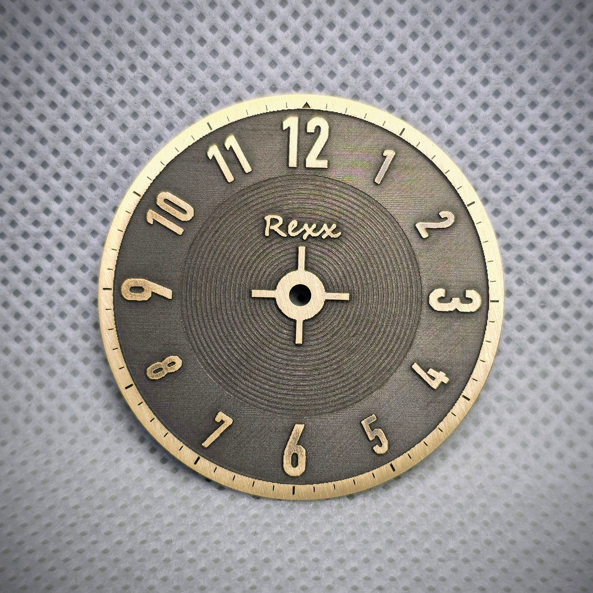 Finished two-tone brass watch dial with raised numerals and engraved texture by Rexx Timepieces