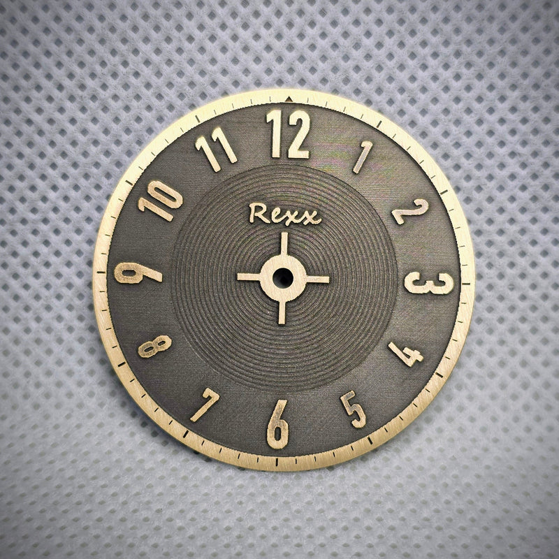 Finished two-tone brass watch dial with raised numerals and engraved texture by Rexx Timepieces