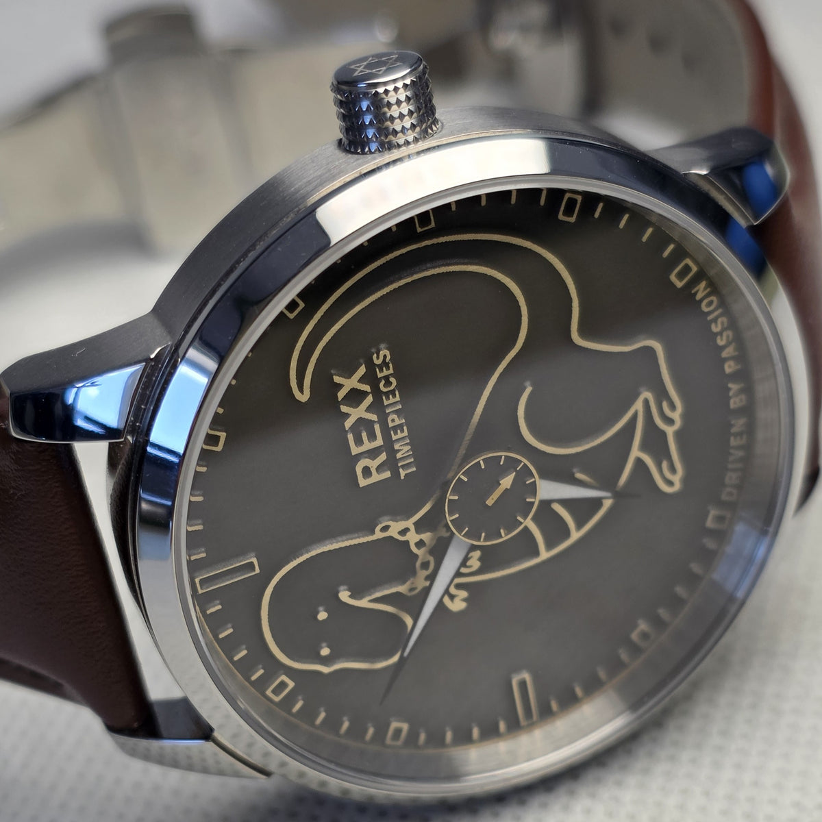 Close-up of the laser-crafted dinosaur dial and miniature rotating seconds watch