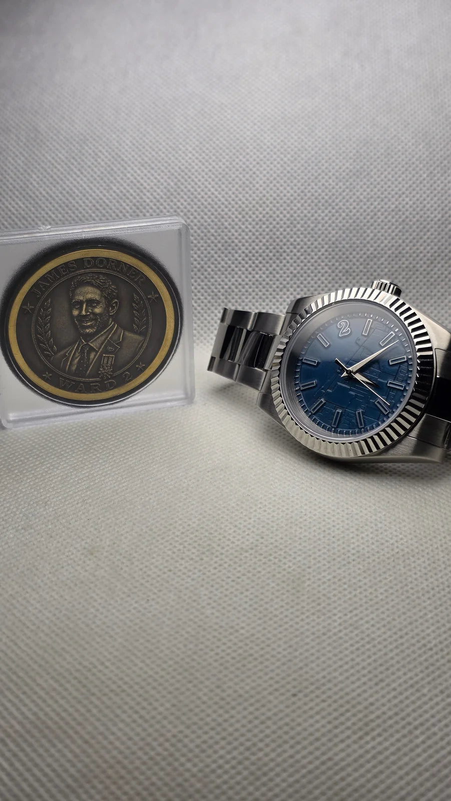 Blue fluted custom watch with a commemorative coin
