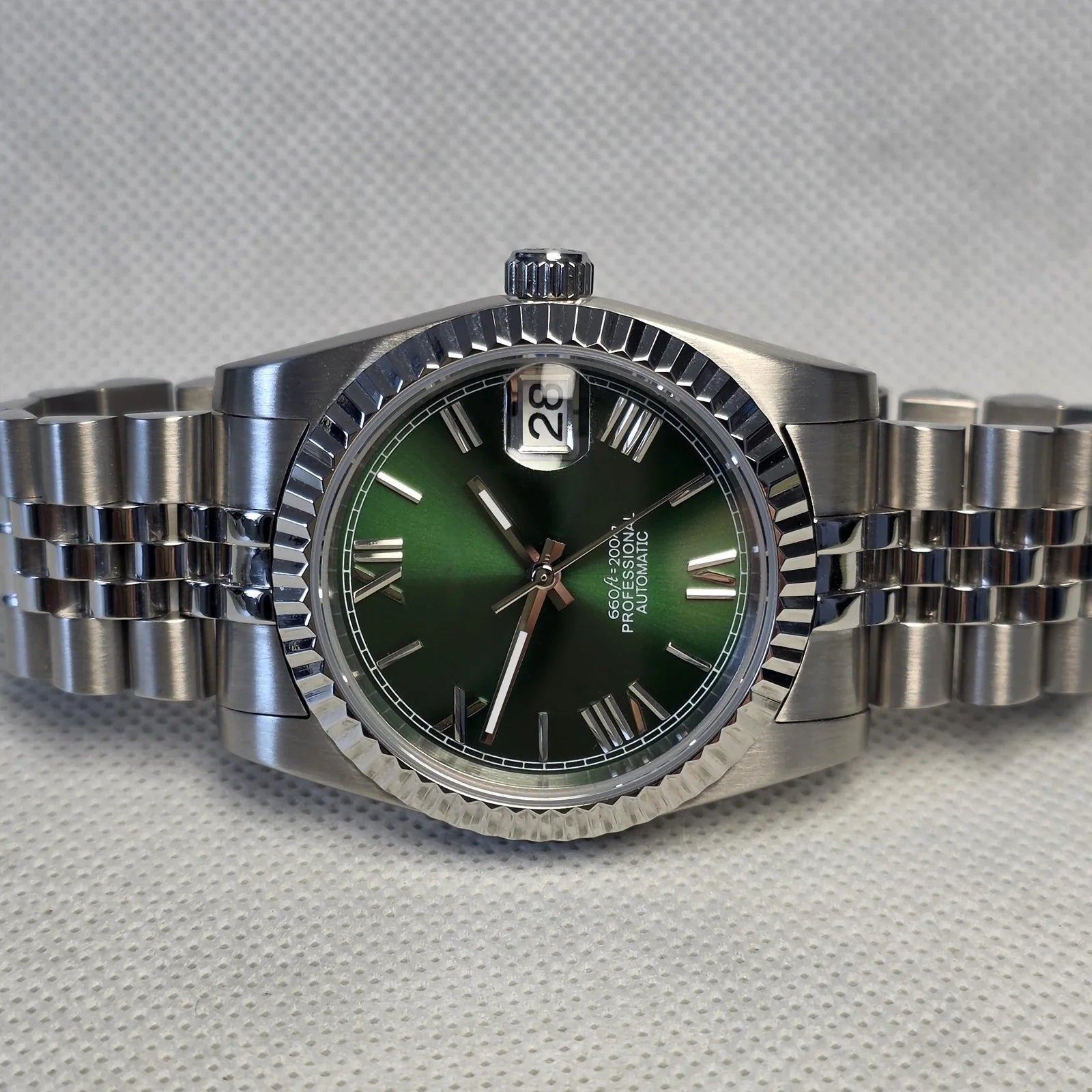 Green fluted custom watch on a steel bracelet