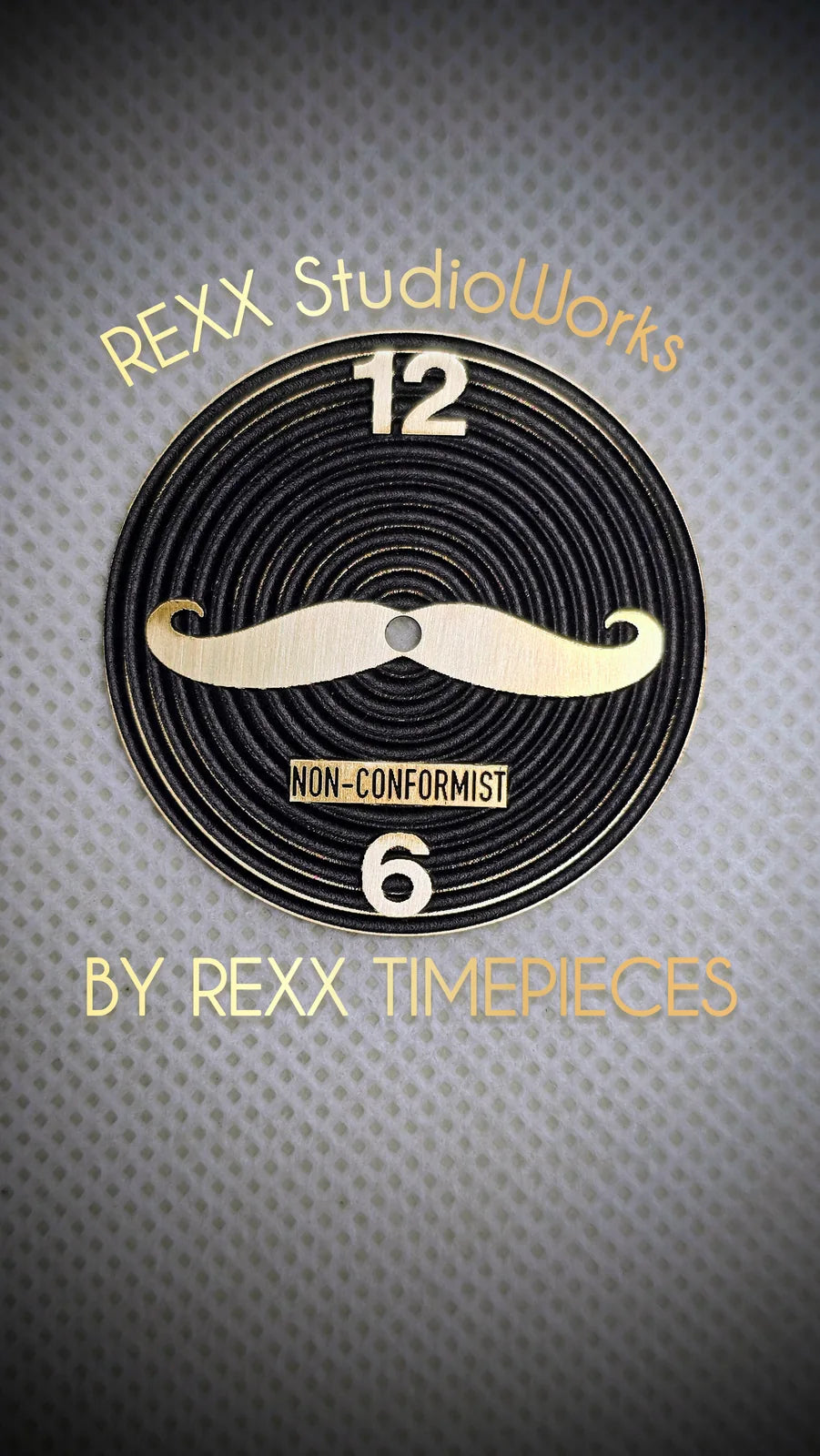 Black engraved dial with moustache hands