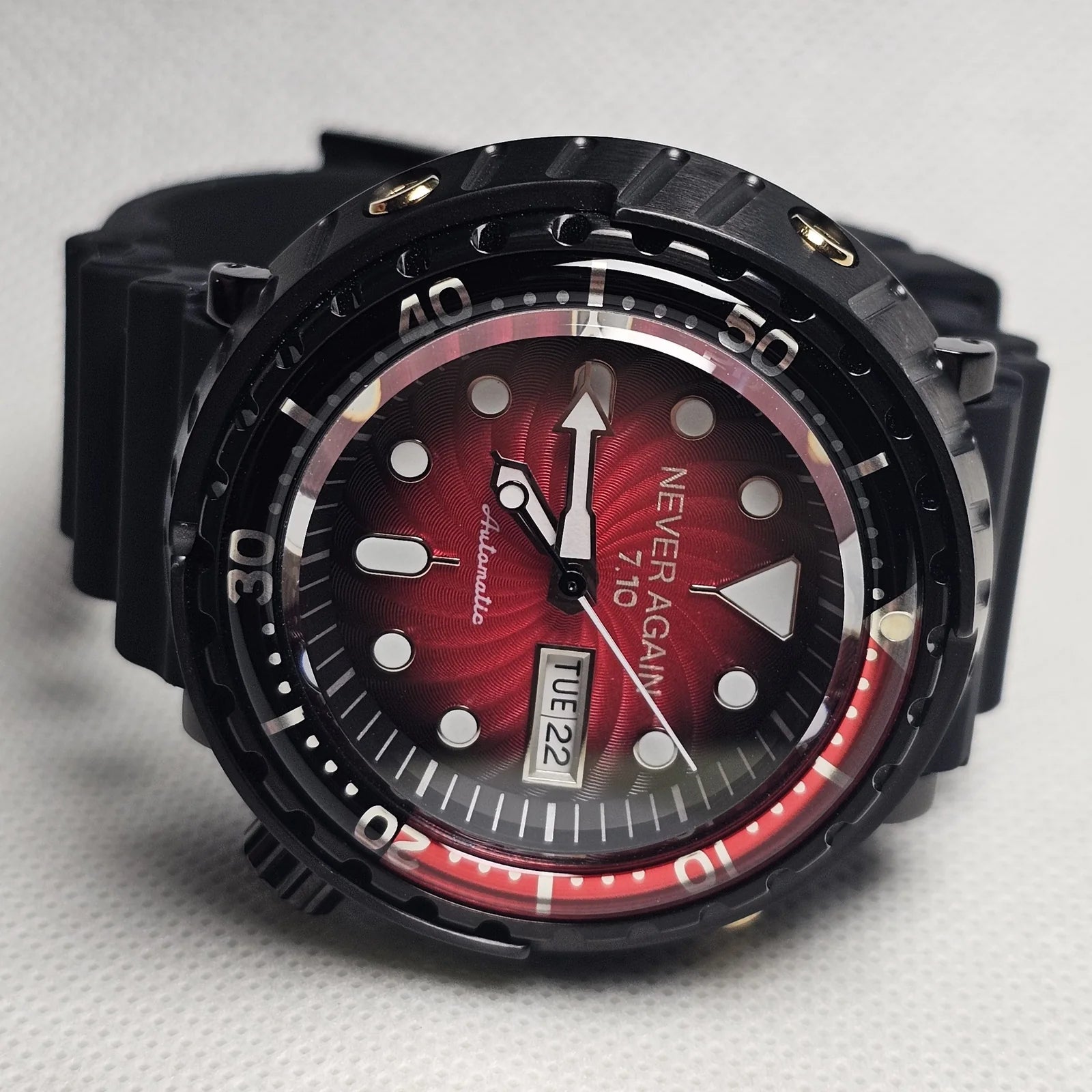 Red and black custom diver watch in a protective case