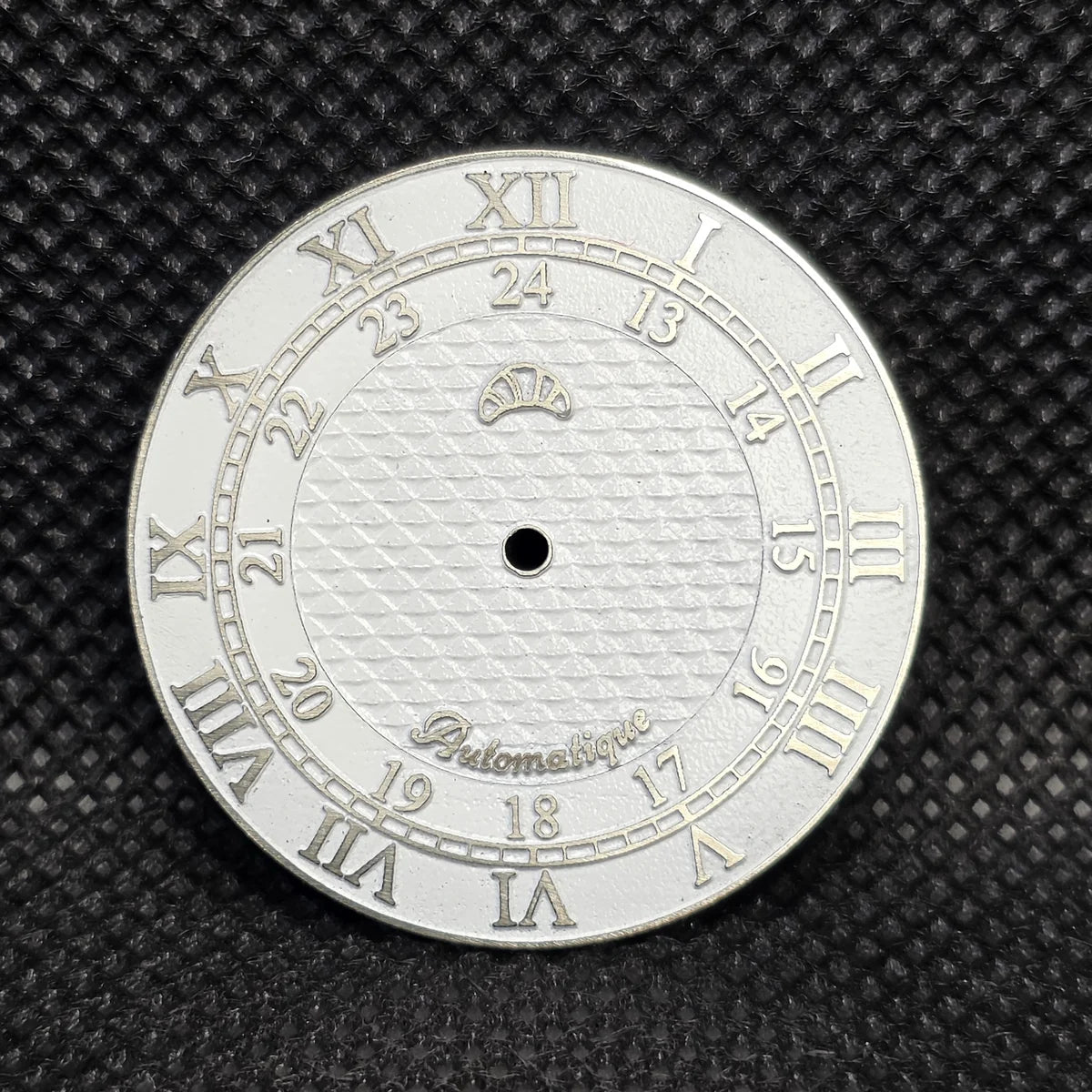 The same Roman-numeral design in a silver tone