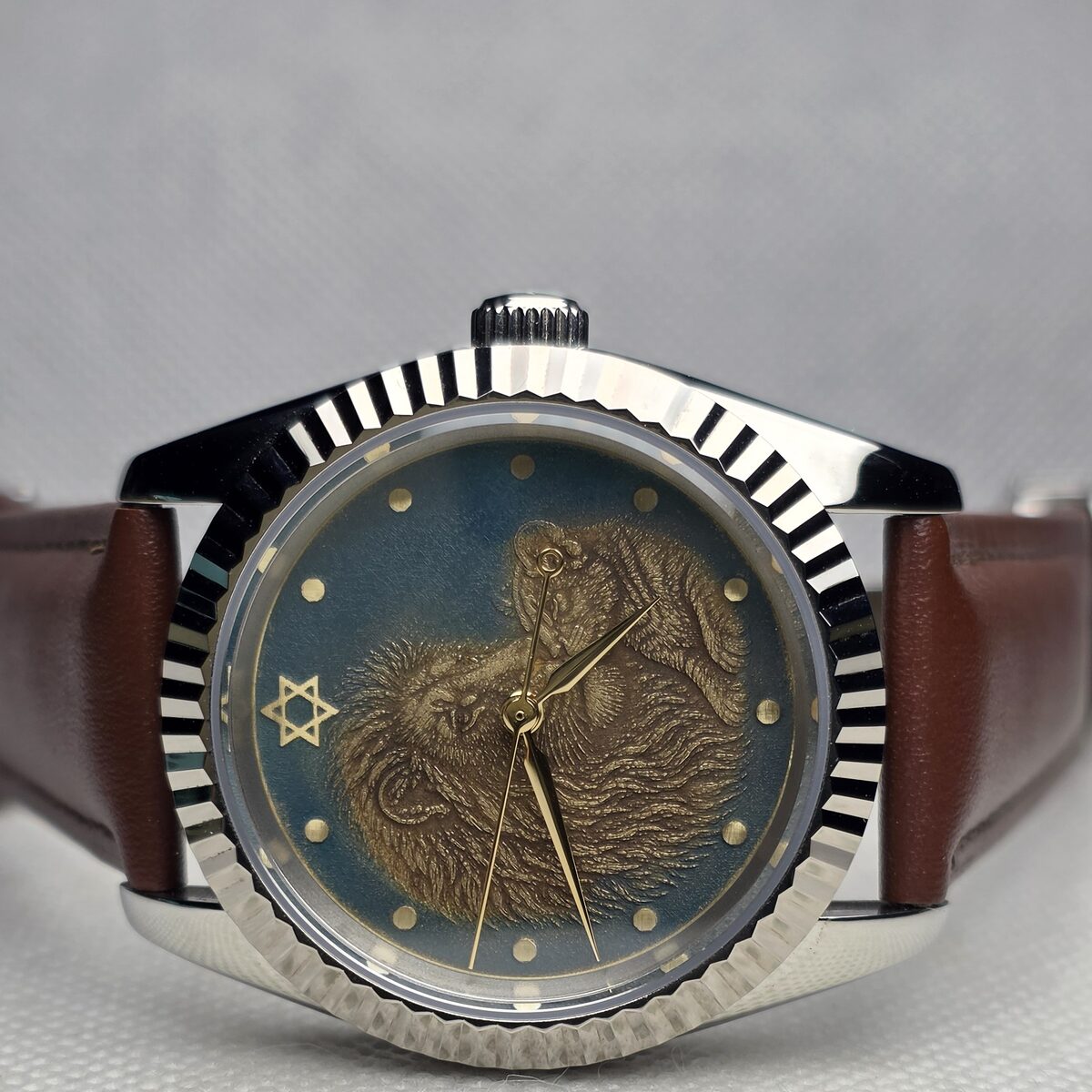 Custom mechanical watch with a dark green figurative engraved dial